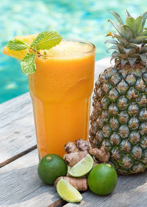 Gorgeous orange and pineapple smoothie next to the pool - be spoiled for choice at Bliss Yoga Retreat where food is unlimited