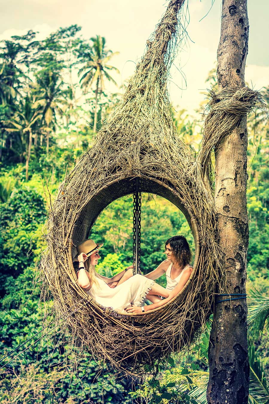 Bali couple cosy in swing